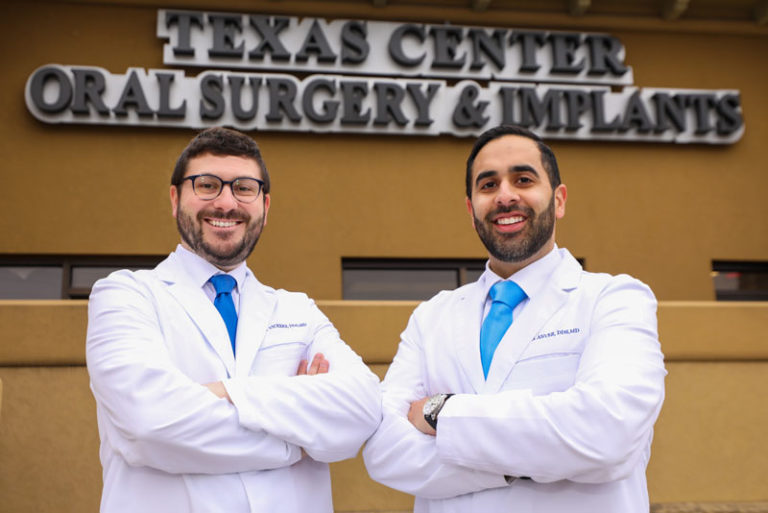 Drs Anver And Vickers Professionally Posing In Front Of The Office, Ready To Talk About The Cost Of Dental Implants