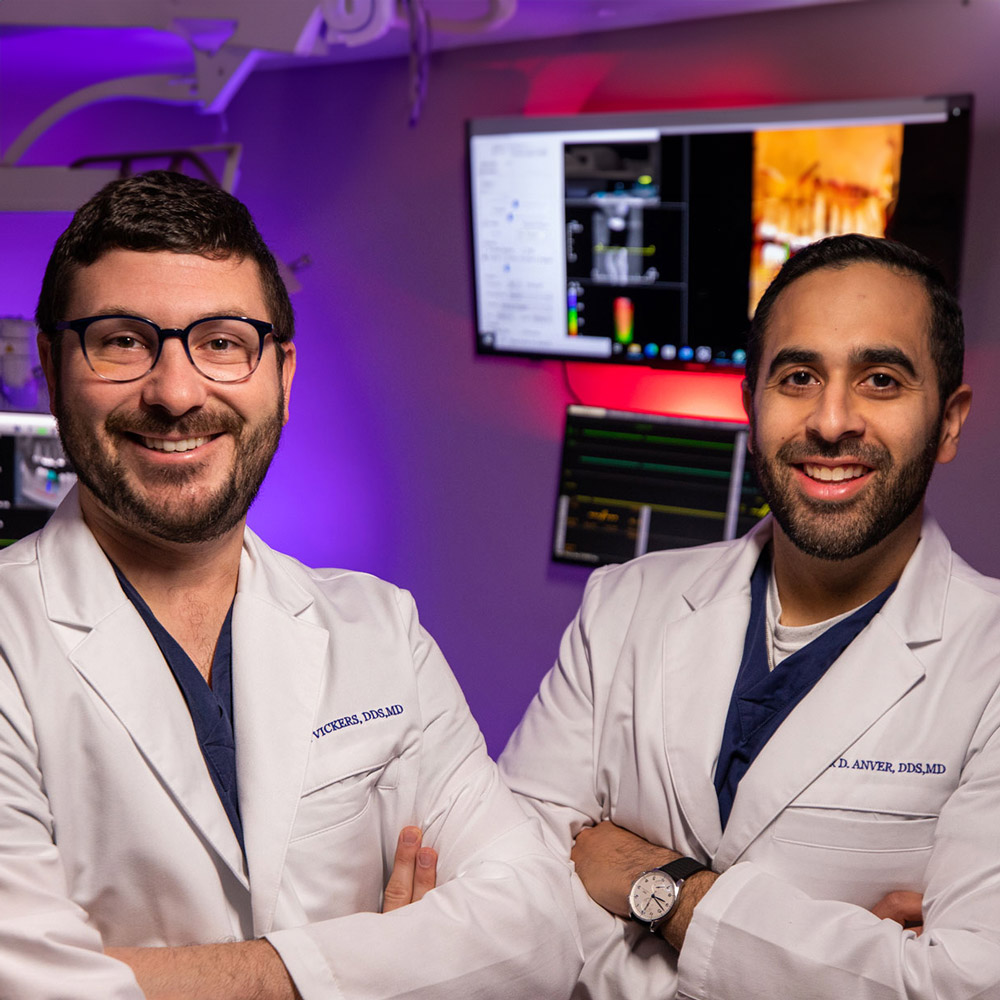 Drs Vickers & Anver Posing In Lab Room In Texas Center For Oral Surgery & Dental Implants