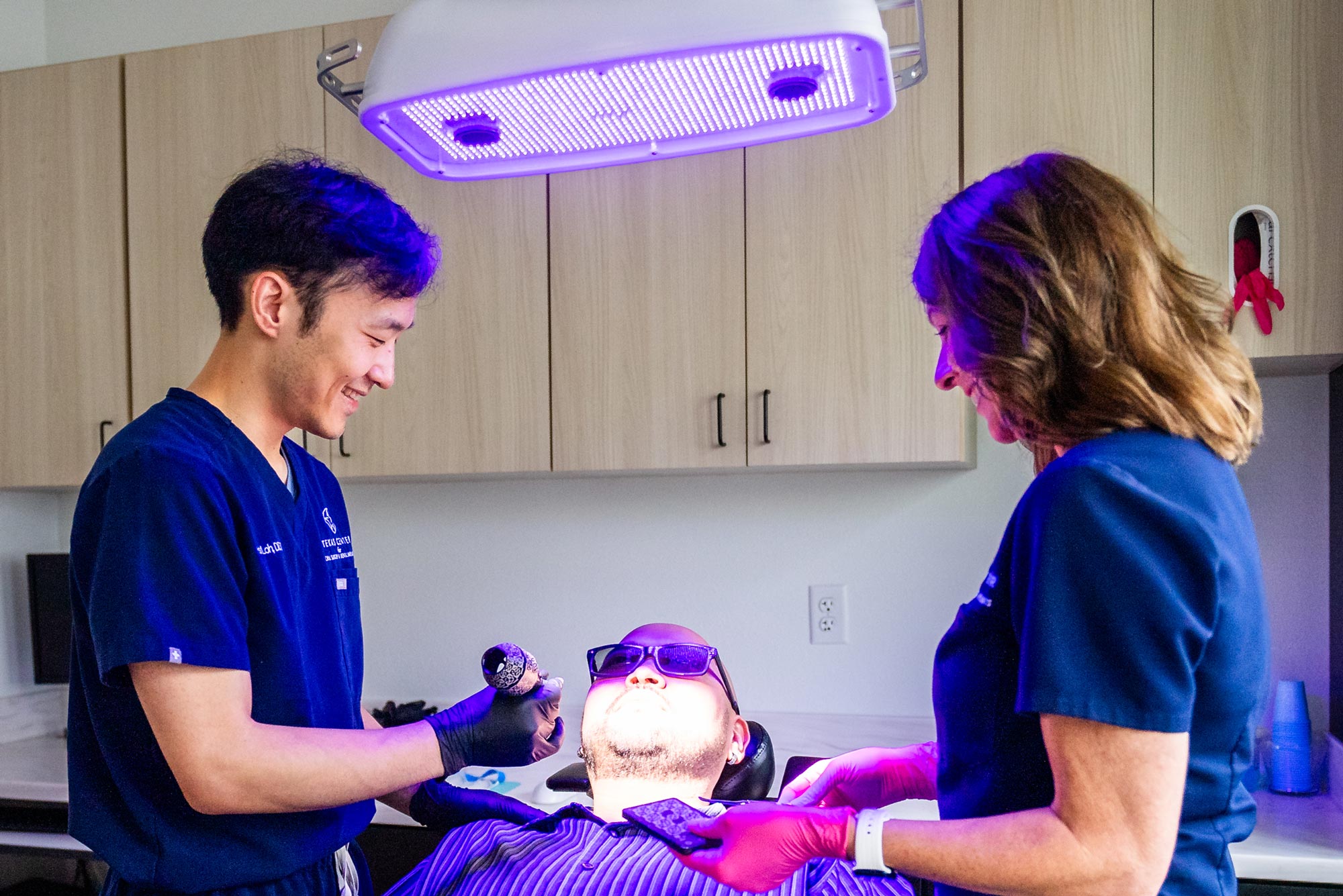 Dr. Loh And Assistant Working On Single Dental Implant Case