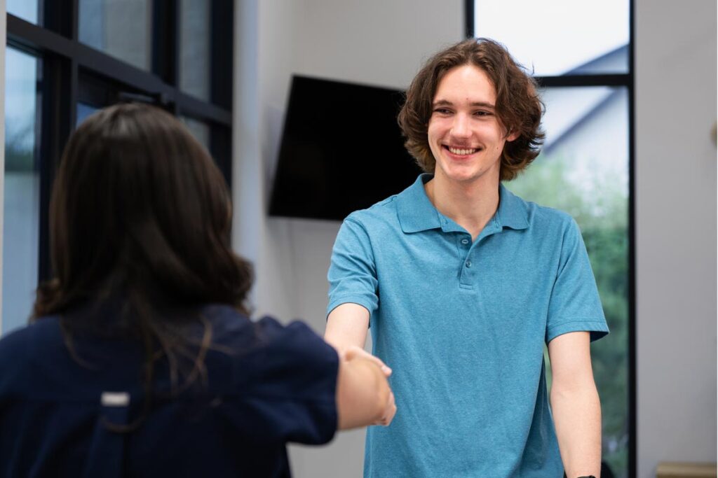 Wisdom Tooth Patient Liam Shaking Dental Assistant's Hand