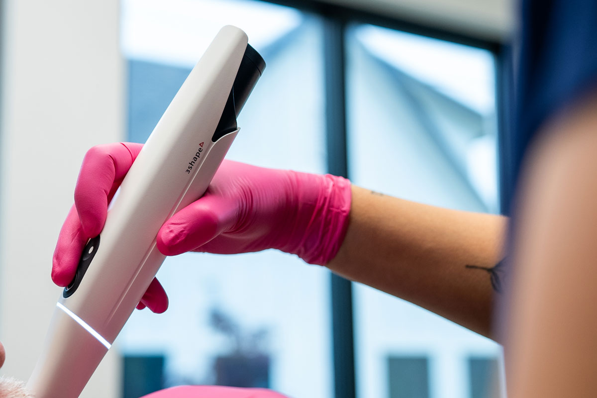 Dental Assistant Scanning Dental Patient's Mouth