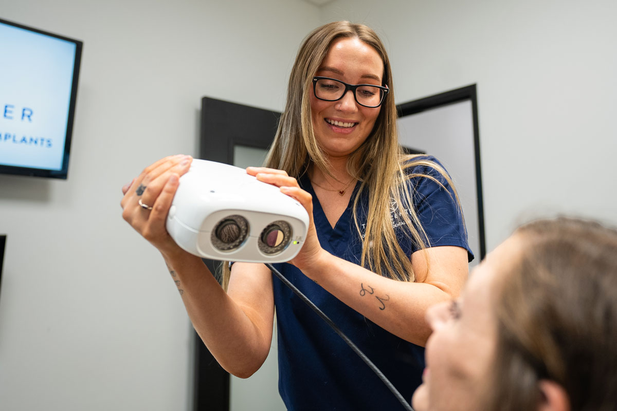 Dental Assistant Scanning Dental Patient's Mouth