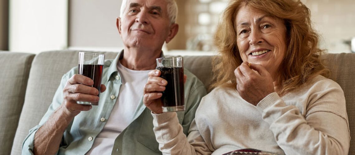 Dental Patients Eating And Drinking Using Their All On 4 Dental Implants