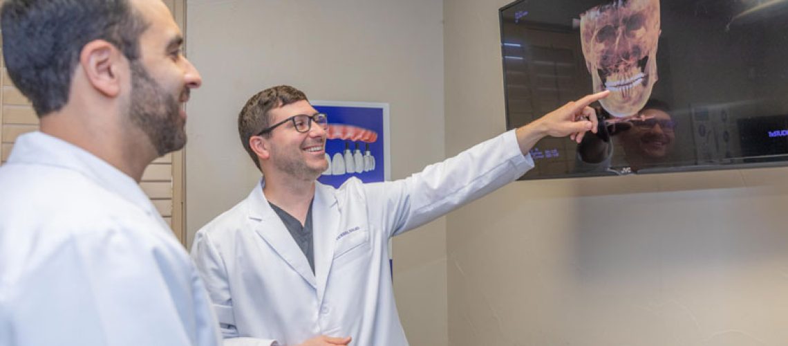 dr anver and dr vickers discussing dental procedure