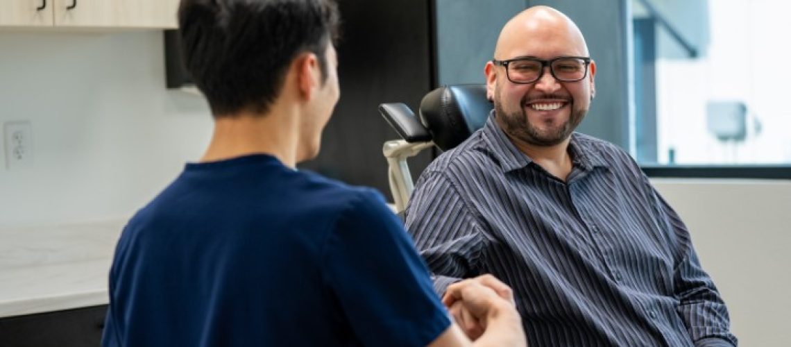 Patient smiling after discussing his full mouth dental implants in Allen TX.
