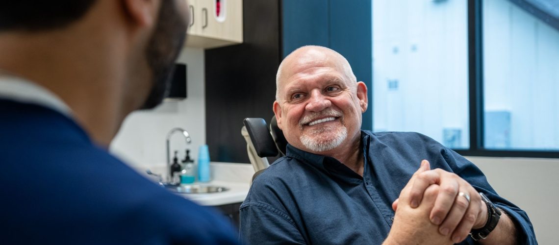 Dr. Tamir Anver shares a smile with his patient after the procedure, the two of them talking through just how easy and painless it turned out to be.